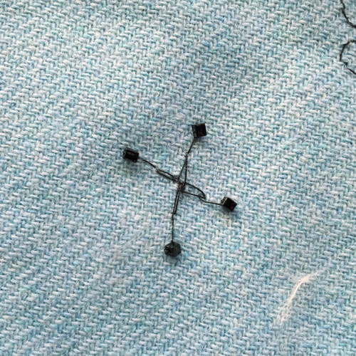hand embroidered childre's drawings onto wool tweed skirt