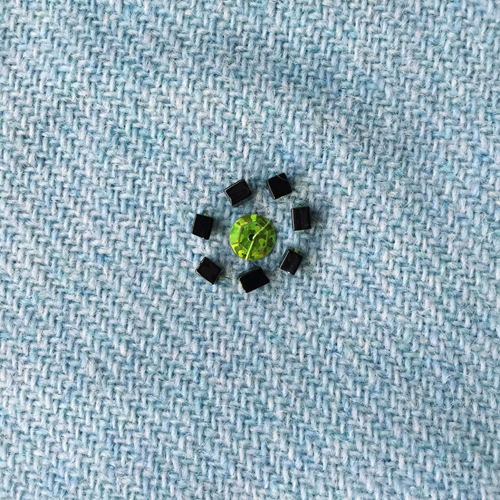 hand embroidered childre's drawings onto wool tweed skirt