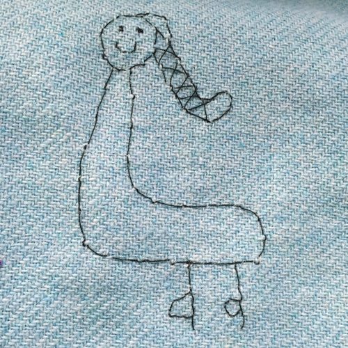 hand embroidered childre's drawings onto wool tweed skirt