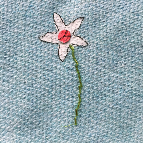 hand embroidered childre's drawings onto wool tweed skirt