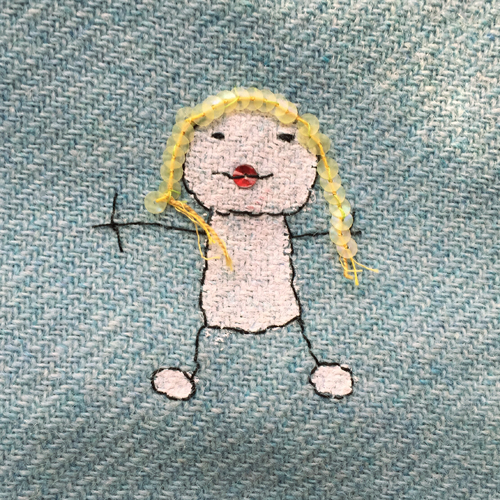 hand embroidered childre's drawings onto wool tweed skirt