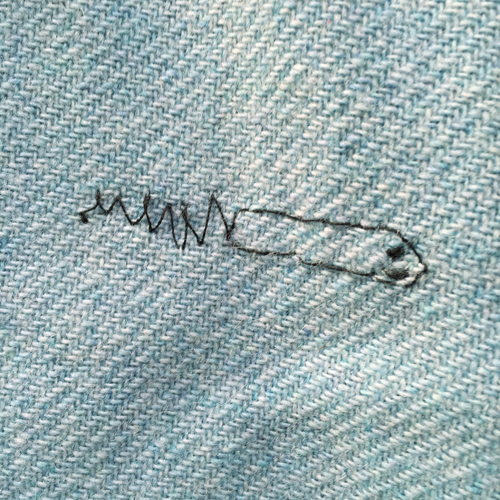 hand embroidered childre's drawings onto wool tweed skirt