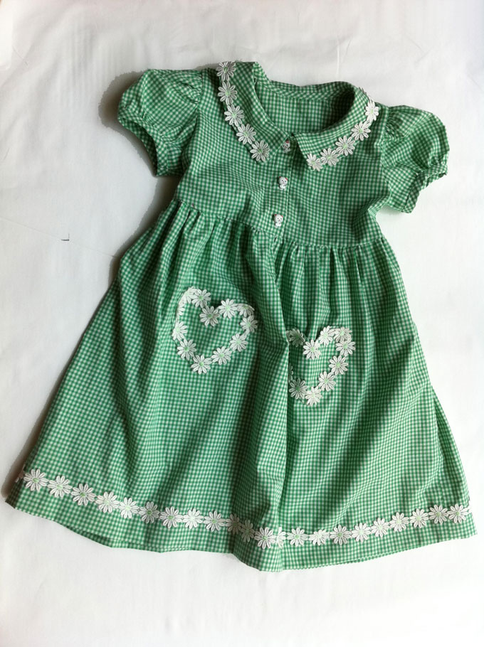 green gingham school dress with heart pockets