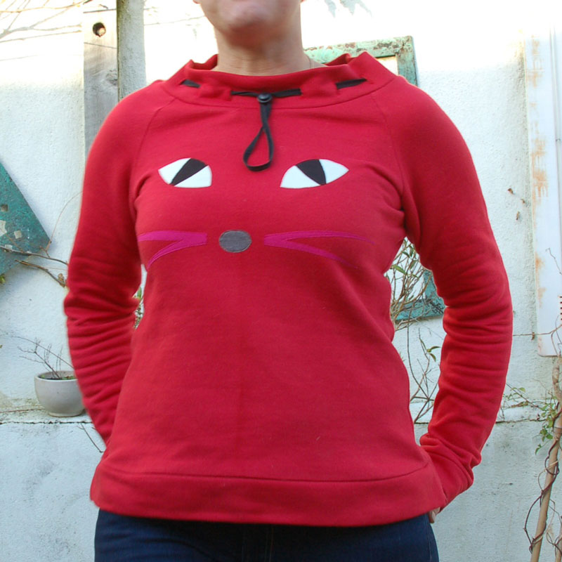 red sweatshirt with pussy cat eyes