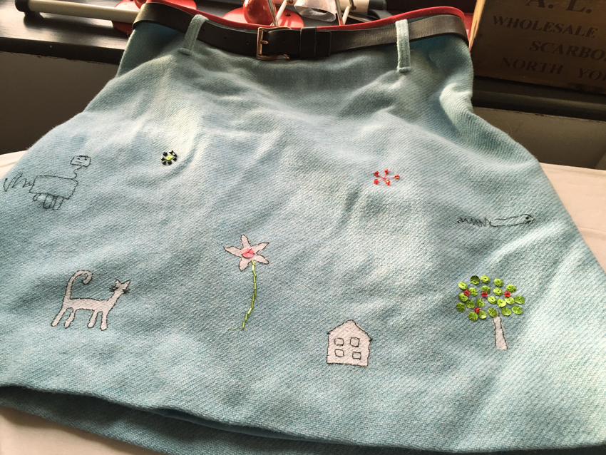 hand embroidered children's drawings onto wool tweed skirt