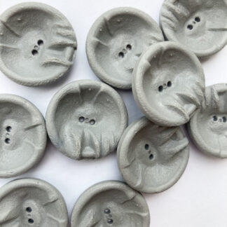 Grey distorted bowl vintage plastic 2 hole button