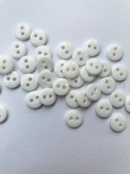 white plastic 2 hole tiny button