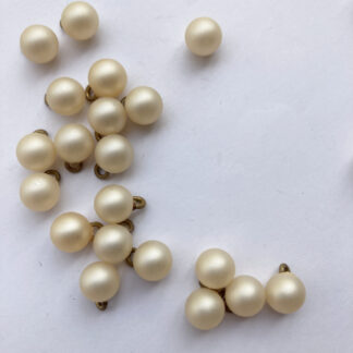 cream pearl effect round plastic ball button with shank