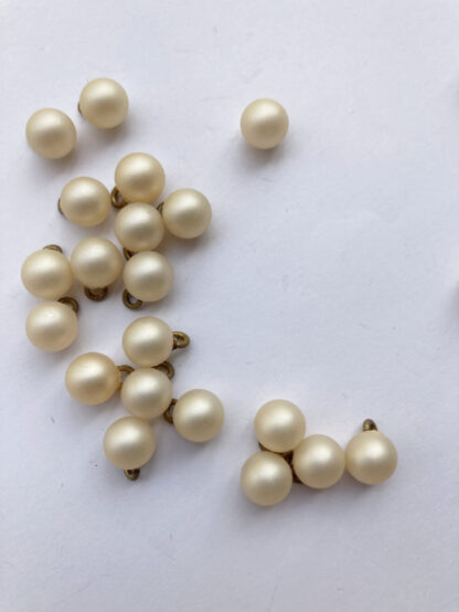 cream pearl effect round plastic ball button with shank