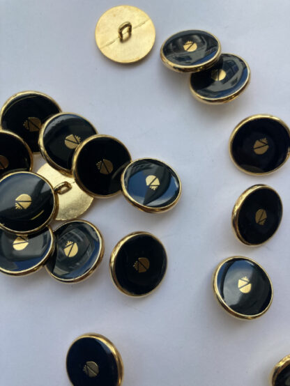 black and gold acorn emblem blazer button