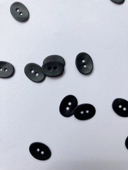 Black matt painted 2 hole shell oval button