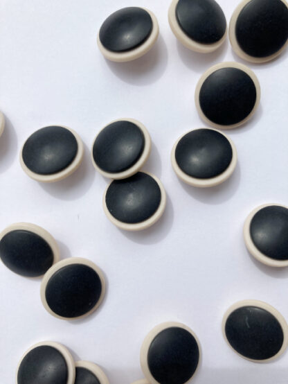 Black and Ecru layered matt plastic shank button