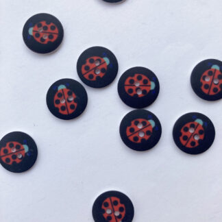 Black and red ladybird print flat 2 hole plastic button