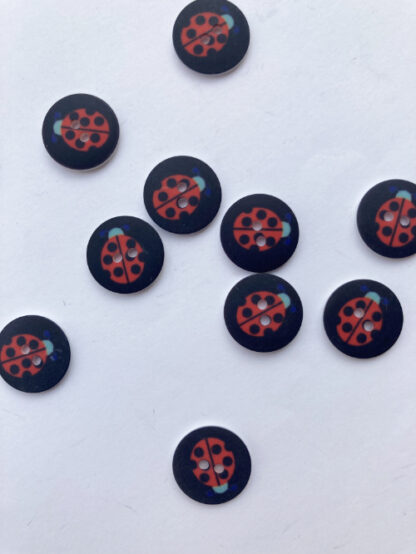 Black and red ladybird print flat 2 hole plastic button