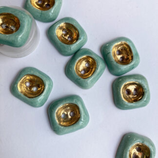 Aqua and Gold ceramic vintage thumb dent 2 hole button