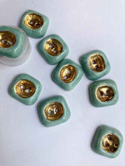 Aqua and Gold ceramic vintage thumb dent 2 hole button