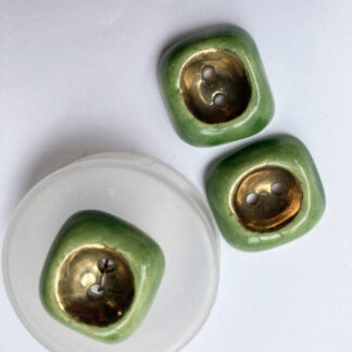 Green and Gold ceramic vintage thumb dent 2 hole button