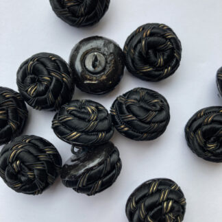 black and gold textile rope knot button