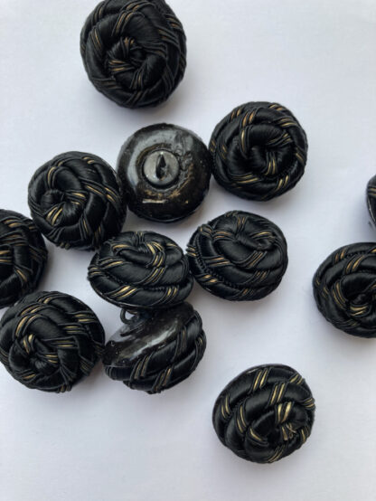 black and gold textile rope knot button