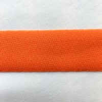 Orange Lycra tape used for binding, stabilising and finishing