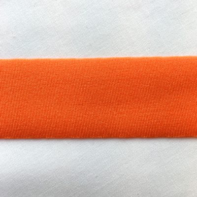 Orange Lycra tape used for binding, stabilising and finishing