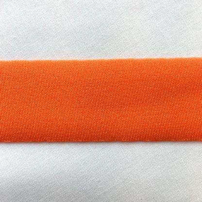 Orange Lycra tape used for binding, stabilising and finishing