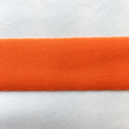 Orange Lycra tape used for binding, stabilising and finishing