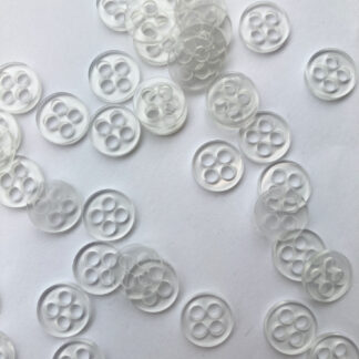 Clear four hole plastic back button