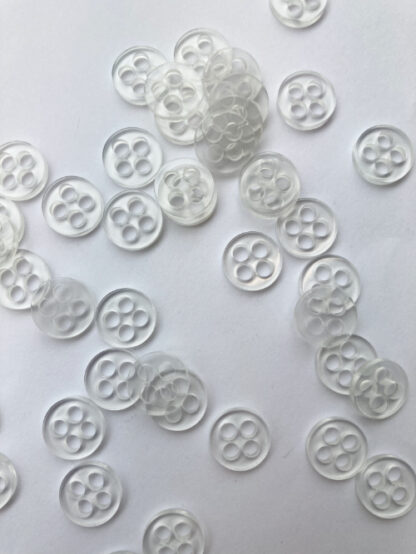 Clear four hole plastic back button