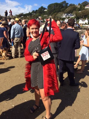 Red guipure lace coat with feather trim