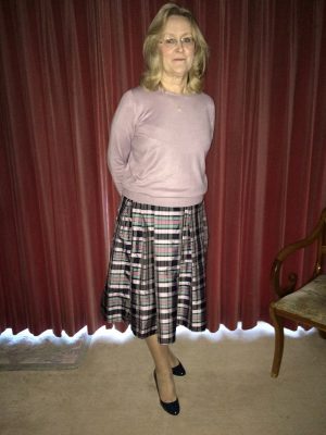 Christina wearing tartan silk flared skirt