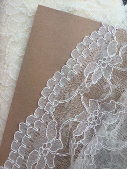 ivory scallop border corded lace