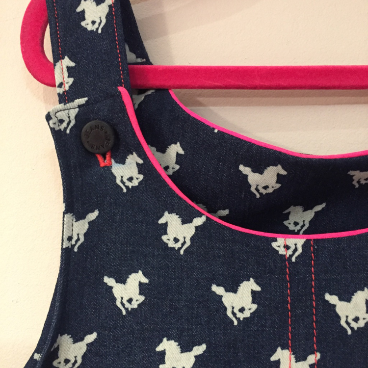 horse print stretch denim pinafore dress with pink trimmings