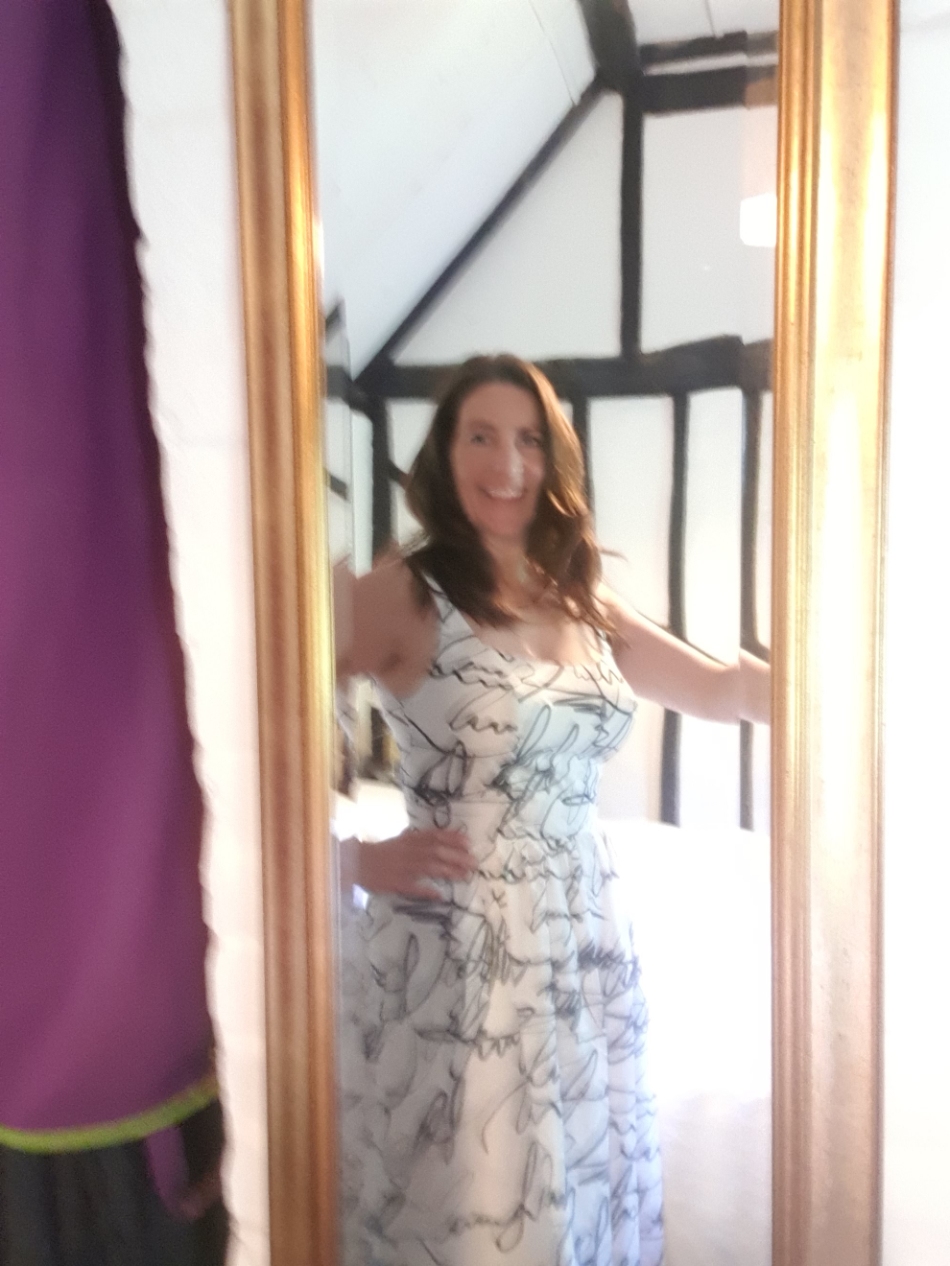 catharine in front of mirror wearing monochrome scribble print cotton voile dress