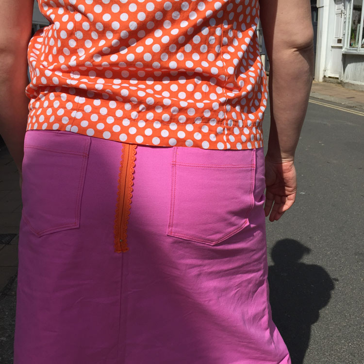 pink panther pink skirt with contrast orange decorative zip