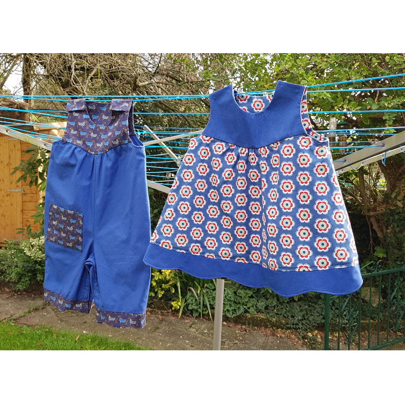 blue cotton romper suit and matching floral dress