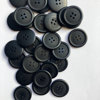 Black plastic four hole button