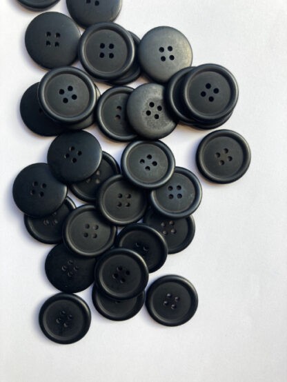 Black plastic four hole button