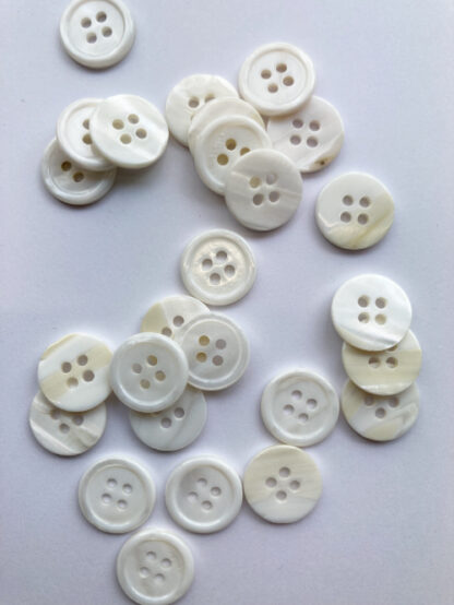 white 4 hole shell button with rim