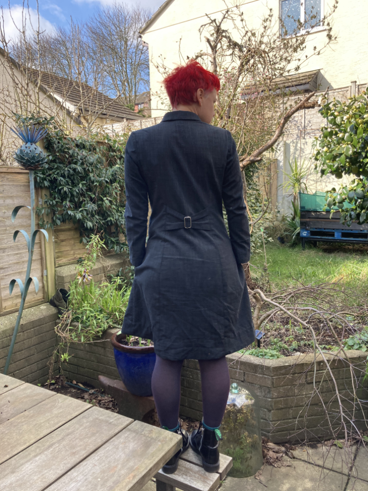 rear view of bleuet dress with altered bow detail using slider buckle