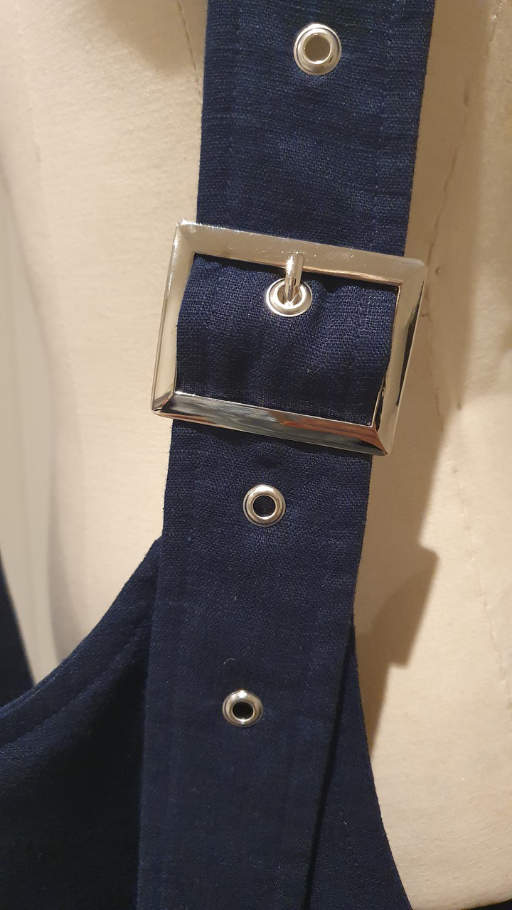 buckle detail with eyelet rivets