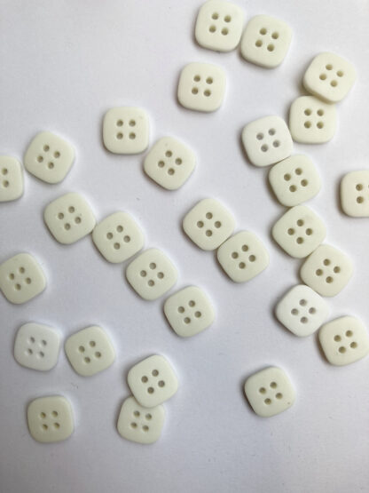 white square plastic shirt buttons