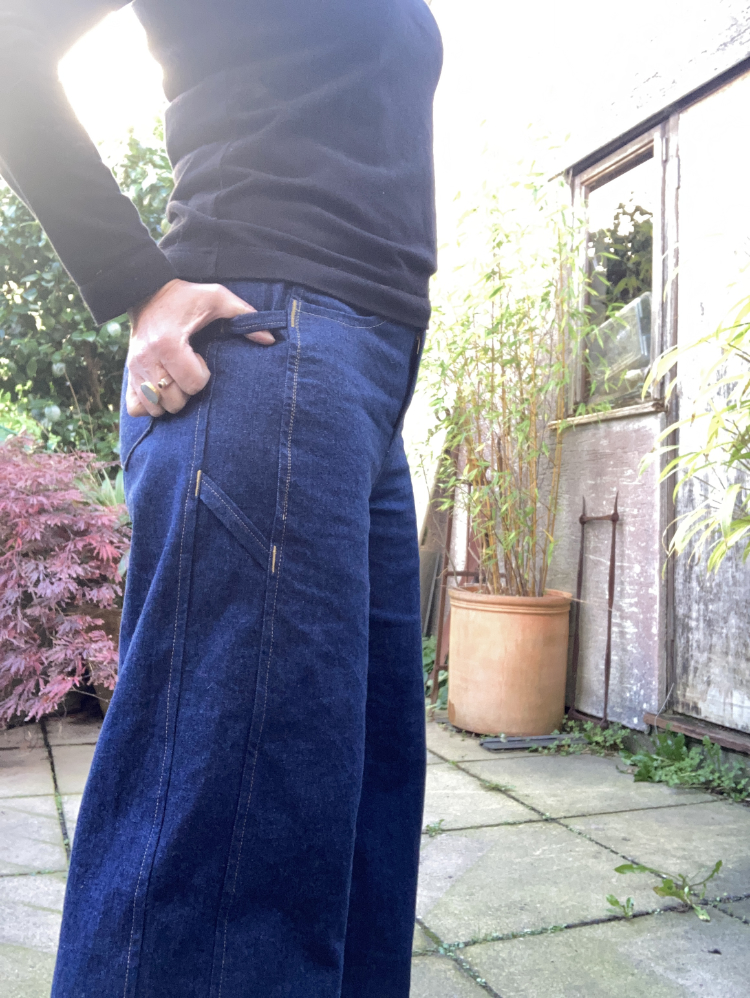 10oz indigo cotton denim narcisse pants - inside showing side panel carpenter tabs (beacause you never know when you might need to hang a hammer off your jeans)10oz indigo cotton denim narcisse pants - side view