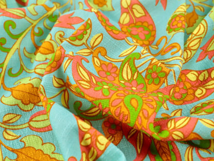 11986 detail close up of aqua lime orange and yellow big paisley print textured bark cloth stretch cotton