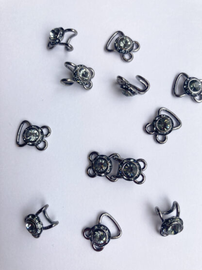 Gunmetal grey metal with faux dark smokey green tourmaline diamanté gemstone decorative hook and eyes. Sold per pair