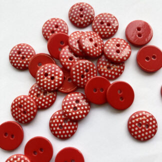 red and white polka dot plastic 2 hole flat button