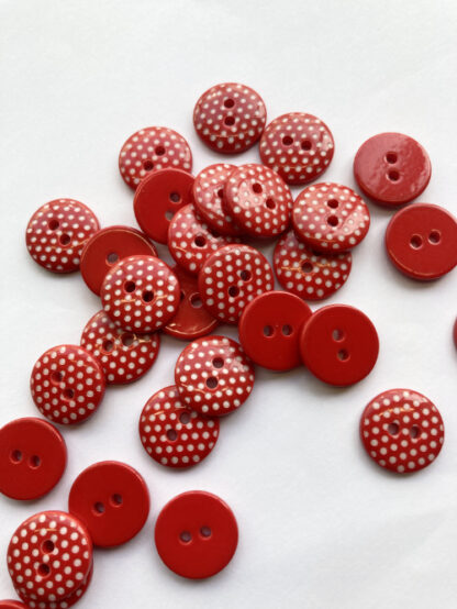 red and white polka dot plastic 2 hole flat button