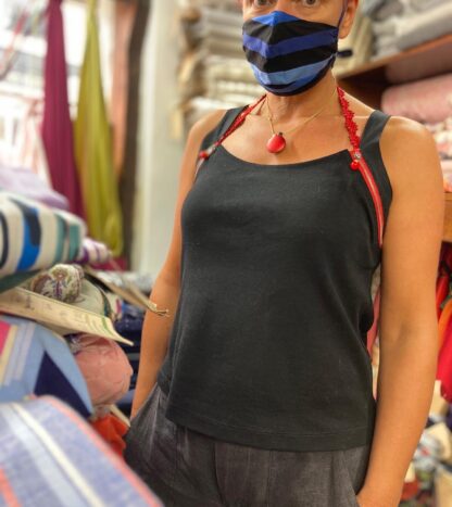 bess wearing tank top made from black fine cotton rib with supima cotton lawn straps and decorative red zips