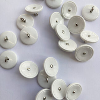 White vintage plastic shank button