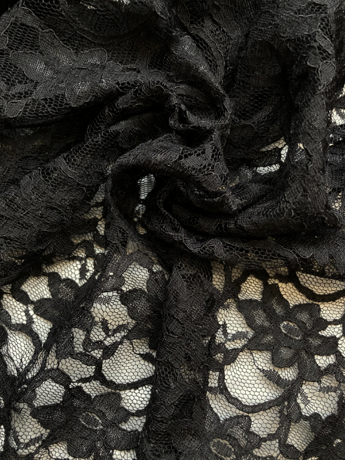 Black 55% Polyamide 45% Cotton corded floral Lace. Double scalloped selvedges